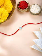 Close-up of 925 Silver Thread Rakhi with Evil Eye featuring red thread, cubic zirconia work, and rhodium plating – ideal for Raksha Bandhan | Peora
