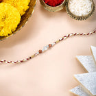 Close-up of Sterling Rakhi with Shining Beads featuring red - silver thread, nan work, and rhodium plating – ideal for Raksha Bandhan | Peora
