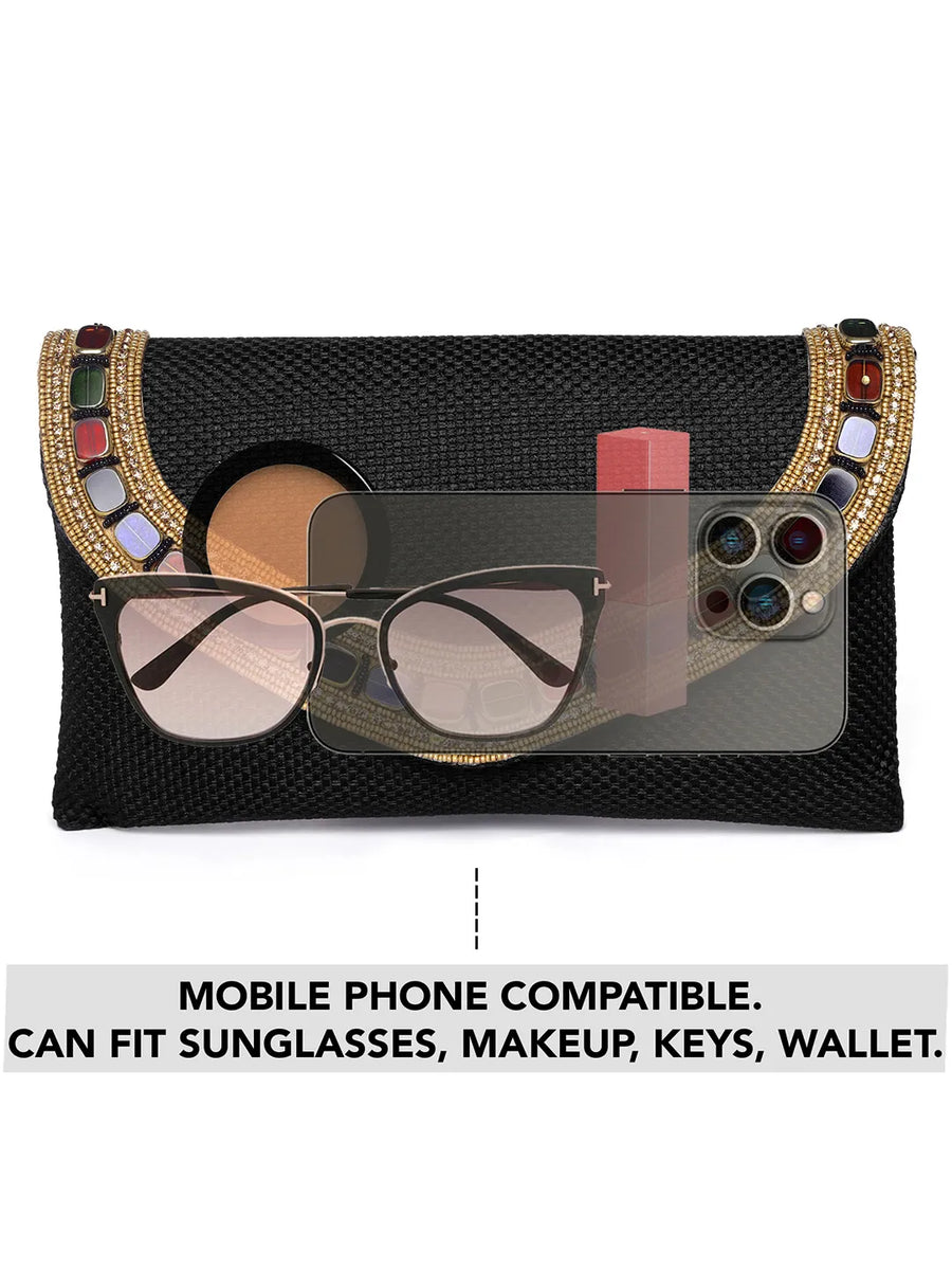 Black clutch bag named Woven Party Clutch with Stone Embellish, featuring faux emerald detailing and soft fabric texture | Peora
