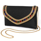 Black clutch bag named Woven Party Clutch with Stone Embellish, featuring faux emerald detailing and soft fabric texture | Peora
