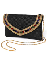 Black clutch bag named Woven Party Clutch with Stone Embellish, featuring faux emerald detailing and soft fabric texture | Peora
