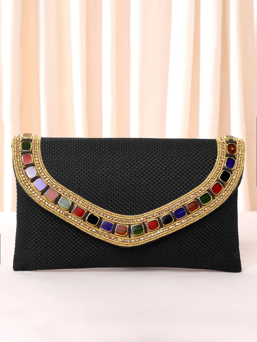 Black clutch bag named Woven Party Clutch with Stone Embellish, featuring faux emerald detailing and soft fabric texture | Peora
