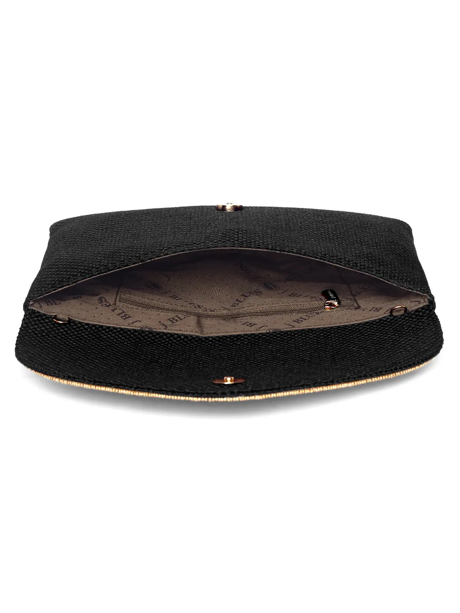 Black clutch bag named Woven Party Clutch with Stone Embellish, featuring faux emerald detailing and soft fabric texture | Peora

