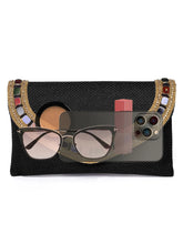 Black clutch bag named Woven Party Clutch with Stone Embellish, featuring faux emerald detailing and soft fabric texture | Peora
