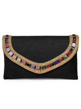Black clutch bag named Woven Party Clutch with Stone Embellish, featuring faux emerald detailing and soft fabric texture | Peora

