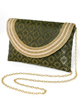 Blue clutch bag named Twilight Gleam Foldover Clutch, featuring pearl detailing and soft fabric texture | Peora
