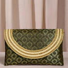 Blue clutch bag named Twilight Gleam Foldover Clutch, featuring pearl detailing and soft fabric texture | Peora
