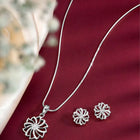 Petite Bloom CZ Floral Pendant Set by Peora. Silver-plating floral pendant necklace and matching earrings with CZ Stones.
