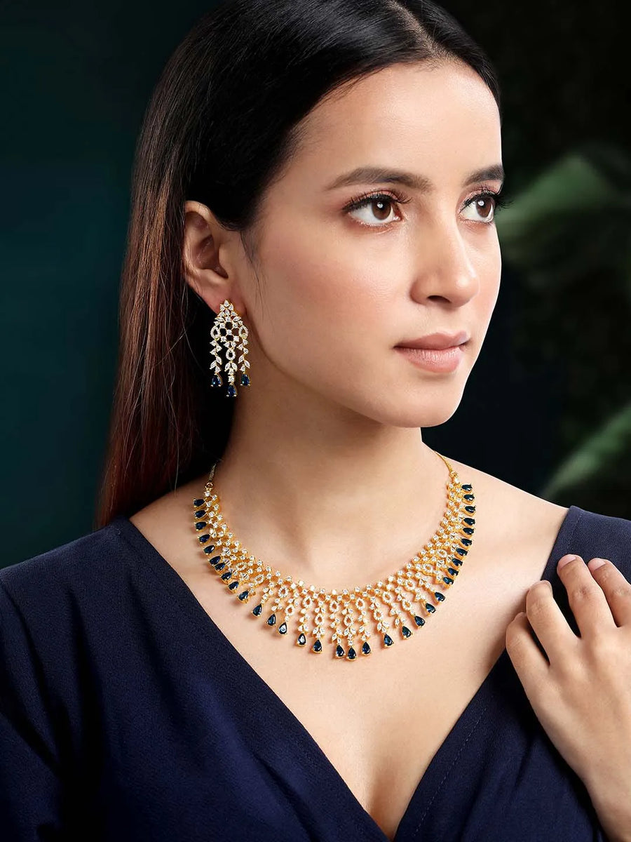 Elegant Shine Sparkling CZ Necklace Set by Peora. Gold-plated necklace with CZ white & blue stones, along with matching earrings.