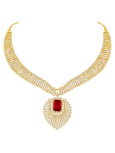 Sparkling Royal Ruby CZ Necklace Set by Peora. Gold-plated necklace set with a geometric pattern and red-colored stones and earrings.