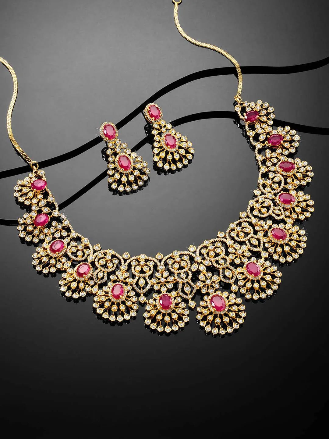 Radiant Ruby CZ and Necklace Set by Peora. Gold-plated necklace set with CZ & ruby stones with intricate designs. Best for weddings & bridal looks.