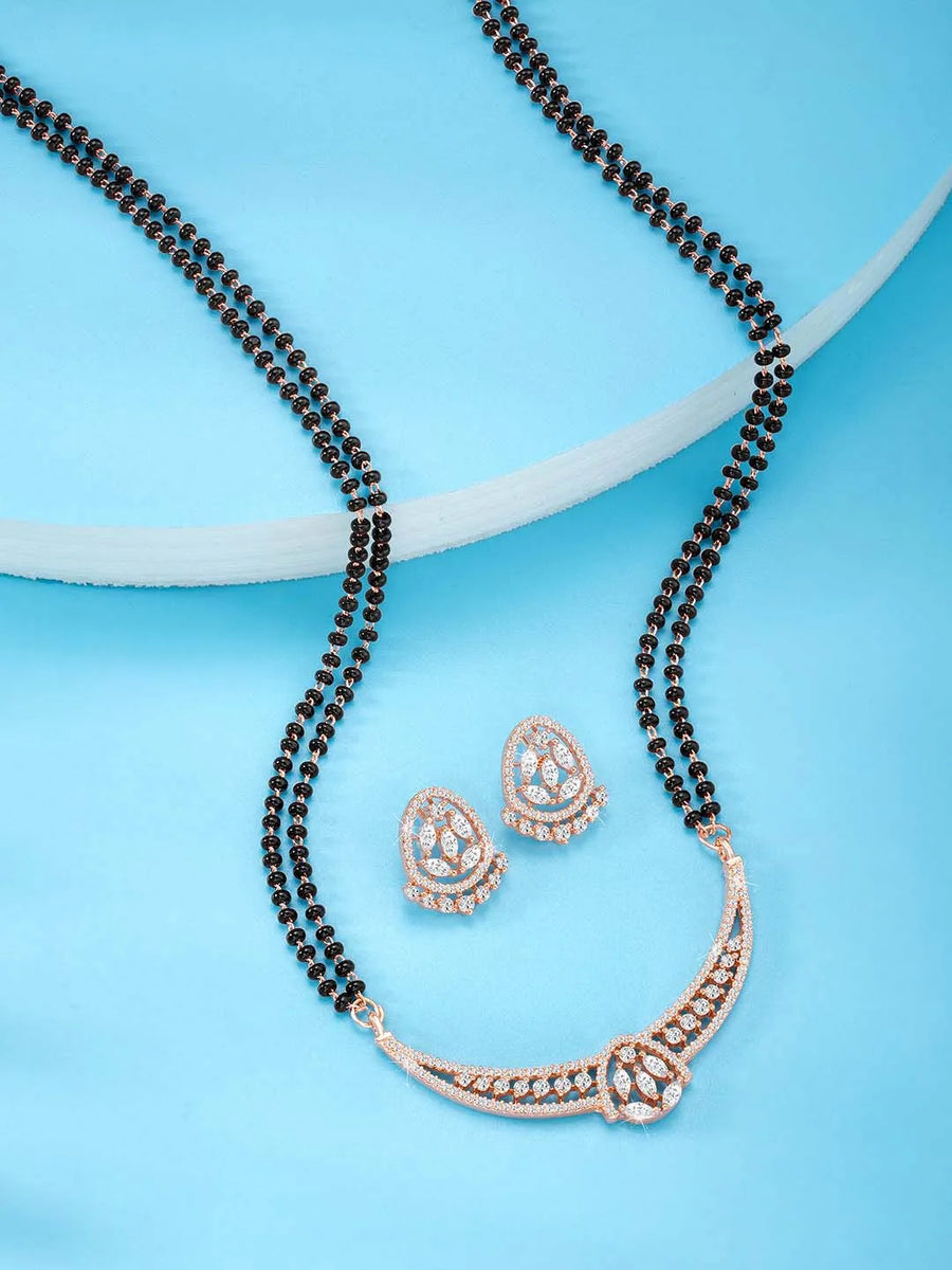 Dazzling CZ Studded Mangalsutra Set. Rose gold plated mangalsutra with earrings & black beads by Peora.