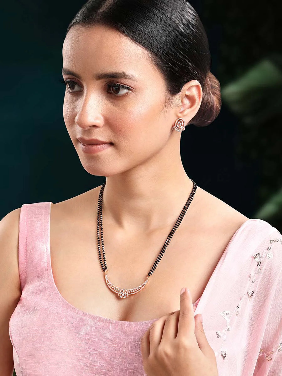 Dazzling CZ Studded Mangalsutra Set. Rose gold plated mangalsutra with earrings & black beads by Peora.
