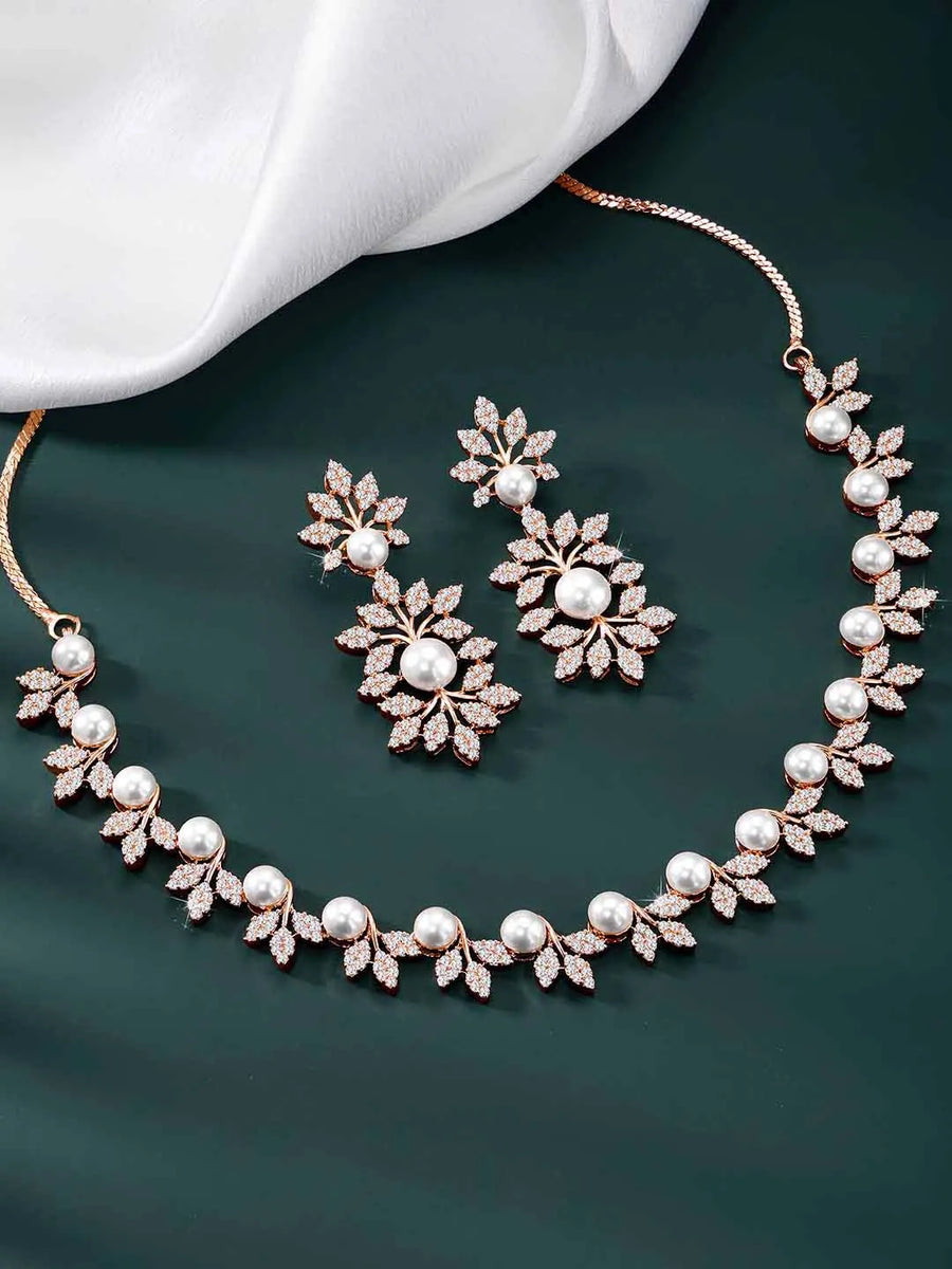 Lustrous Luxe CZ Stud Necklace Set. Rose gold-plated with white cubic zirconia stones, pearls, and floral design, with matching earrings.