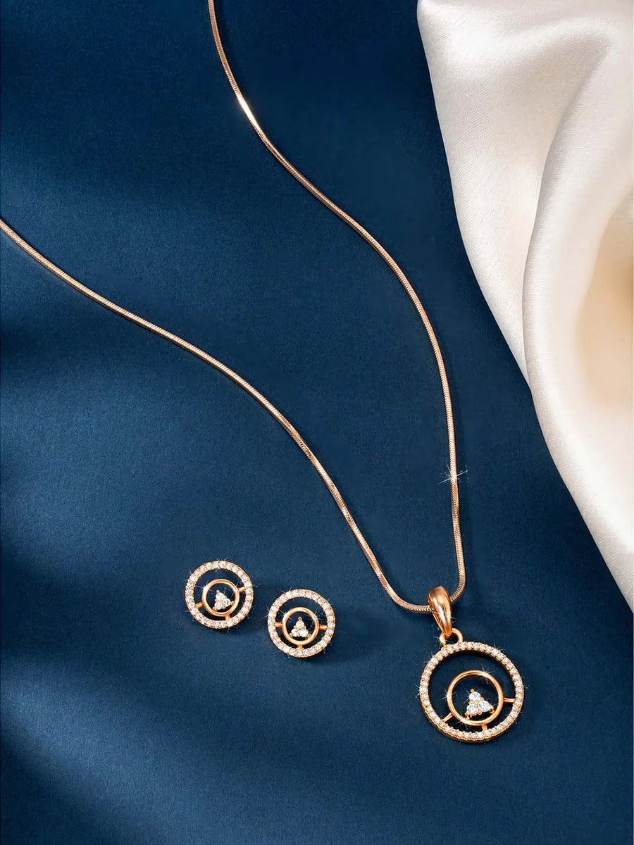 Elegant CZ Round Pendant Orbit Set. Rose gold-plated pendant necklace and a pair of earrings with a round pendant & CZ stones.