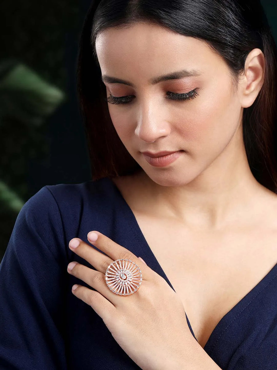 Dazzling Sparkle CZ Statement Ring. Rose gold-plated statement ring with a large central cubic zirconia and multiple surrounding smaller stones.