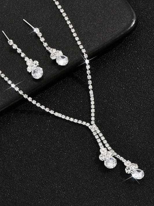 Silver necklace earrings set crafted from alloy, adorned with crystals & cubic zirconia for an elegant, timeless look | Peora
