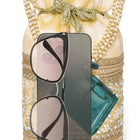 Cream potli bag named Exquisite Charming Embroidery Potli, featuring faux pearl detailing and soft fabric texture | Peora
