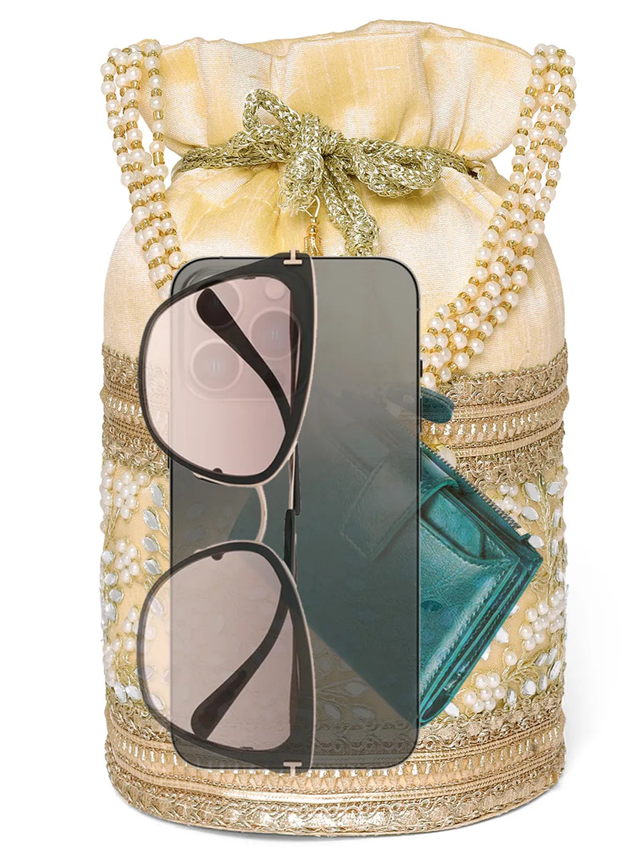 Cream potli bag named Exquisite Charming Embroidery Potli, featuring faux pearl detailing and soft fabric texture | Peora
