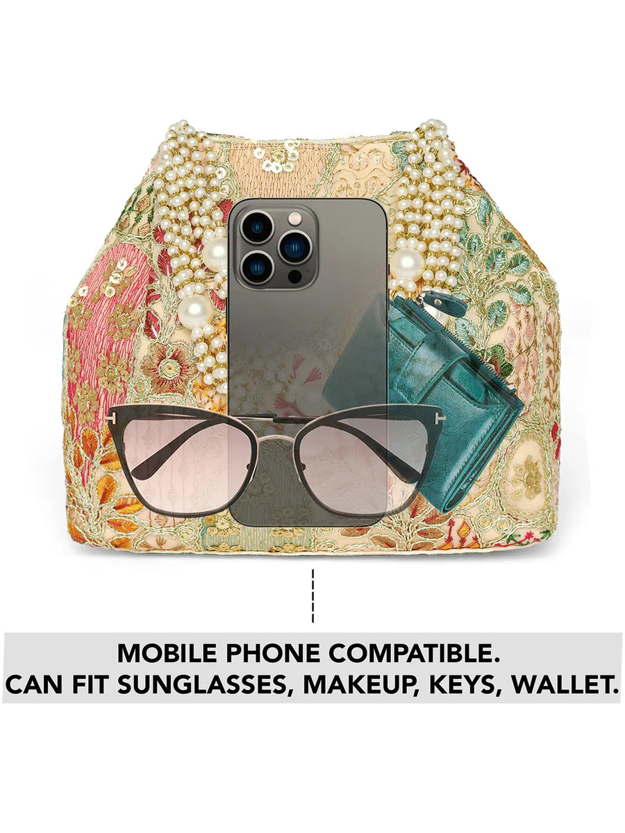 Cream potli bag named Royal Charm Handcrafted Embroidery Potli, featuring artificial beads detailing and soft fabric texture | Peora
