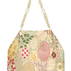 Cream potli bag named Royal Charm Handcrafted Embroidery Potli, featuring artificial beads detailing and soft fabric texture | Peora
