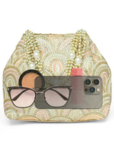 Cream potli bag named Sequin Wave Embellished Potli Bag, featuring artificial beads detailing and soft fabric texture | Peora
