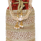 Maroon potli bag named Sequin & Pearl Embellished Potli Bag, featuring faux pearl detailing and soft fabric texture | Peora
