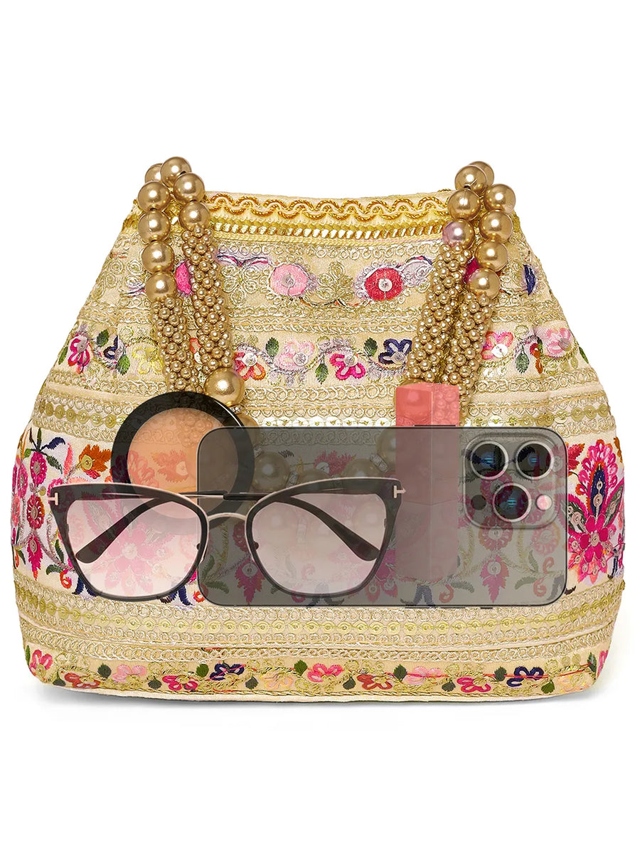 Cream potli bag named Thread Embroidery Potli with Sequin Motif, featuring artificial beads detailing and soft fabric texture | Peora
