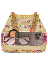 Cream potli bag named Thread Embroidery Potli with Sequin Motif, featuring artificial beads detailing and soft fabric texture | Peora
