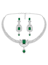 Emerald Elegance Crystal CZ Necklace Set. A silver-colored necklace and earring set with green emerald stones and clear cubic zirconia accents.