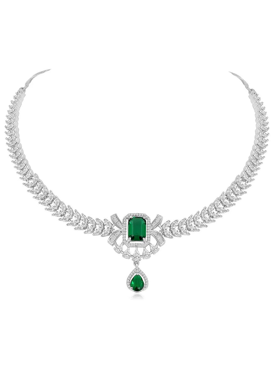 Emerald Elegance Crystal CZ Necklace Set. A silver-colored necklace and earring set with green emerald stones and clear cubic zirconia accents.