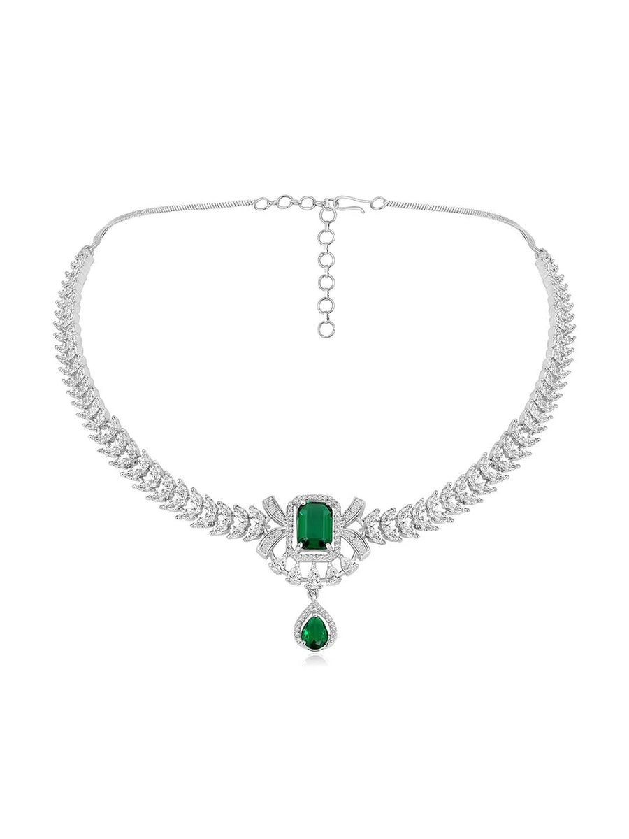 Emerald Elegance Crystal CZ Necklace Set. A silver-colored necklace and earring set with green emerald stones and clear cubic zirconia accents.