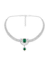 Emerald Elegance Crystal CZ Necklace Set. A silver-colored necklace and earring set with green emerald stones and clear cubic zirconia accents.
