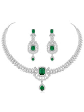 Emerald Elegance Crystal CZ Necklace Set. A silver-colored necklace and earring set with green emerald stones and clear cubic zirconia accents.