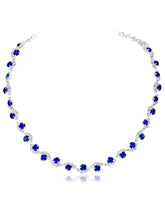 Blue necklace earrings set crafted from alloy, adorned with crystals & cubic zirconia for an elegant, timeless look | Peora
