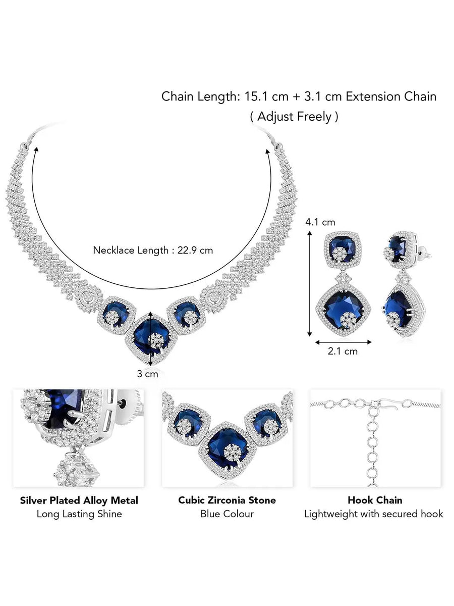 Exquisite CZ Necklace Sets Collection. A silver-colored necklace and earring set with blue and white cubic zirconia stones.