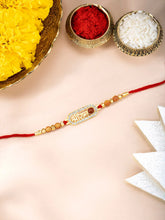 Close-up of Rudraksha Rakhi with Shree Ram with red thread, adorned with crystals & beads and finished in gold plating | Peora
