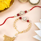 Close-up of Dual Layer Kundan Lumba Rakhi Set featuring maroon & gold thread, kundan & beads work, and gold plating – ideal for Raksha Bandhan | Peora
