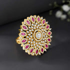 Bold Radiant Statement CZ Ring by Peora. Gold-Plated Adjustable ring with cubic zirconia in a radiant pattern, central larger crystal surrounded by smaller crystals in red.