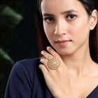 Bold Radiant Statement CZ Ring by Peora. Gold-Plated Adjustable ring with cubic zirconia in a radiant pattern, central larger crystal surrounded by smaller crystals in red.