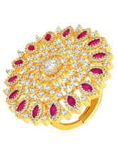 Bold Radiant Statement CZ Ring by Peora. Gold-Plated Adjustable ring with cubic zirconia in a radiant pattern, central larger crystal surrounded by smaller crystals in red.