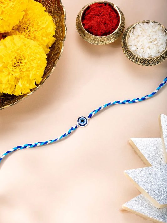 Close-up of Sterling Rakhi with Evil Eye Bead featuring blue & white thread, nan work, and rhodium plating – ideal for Raksha Bandhan | Peora
