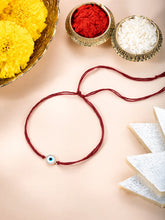 Close-up of Protective Evil Eye & CZ Silver Rakhi featuring maroon thread, cubic zirconia work, and rhodium plating – ideal for Raksha Bandhan | Peora
