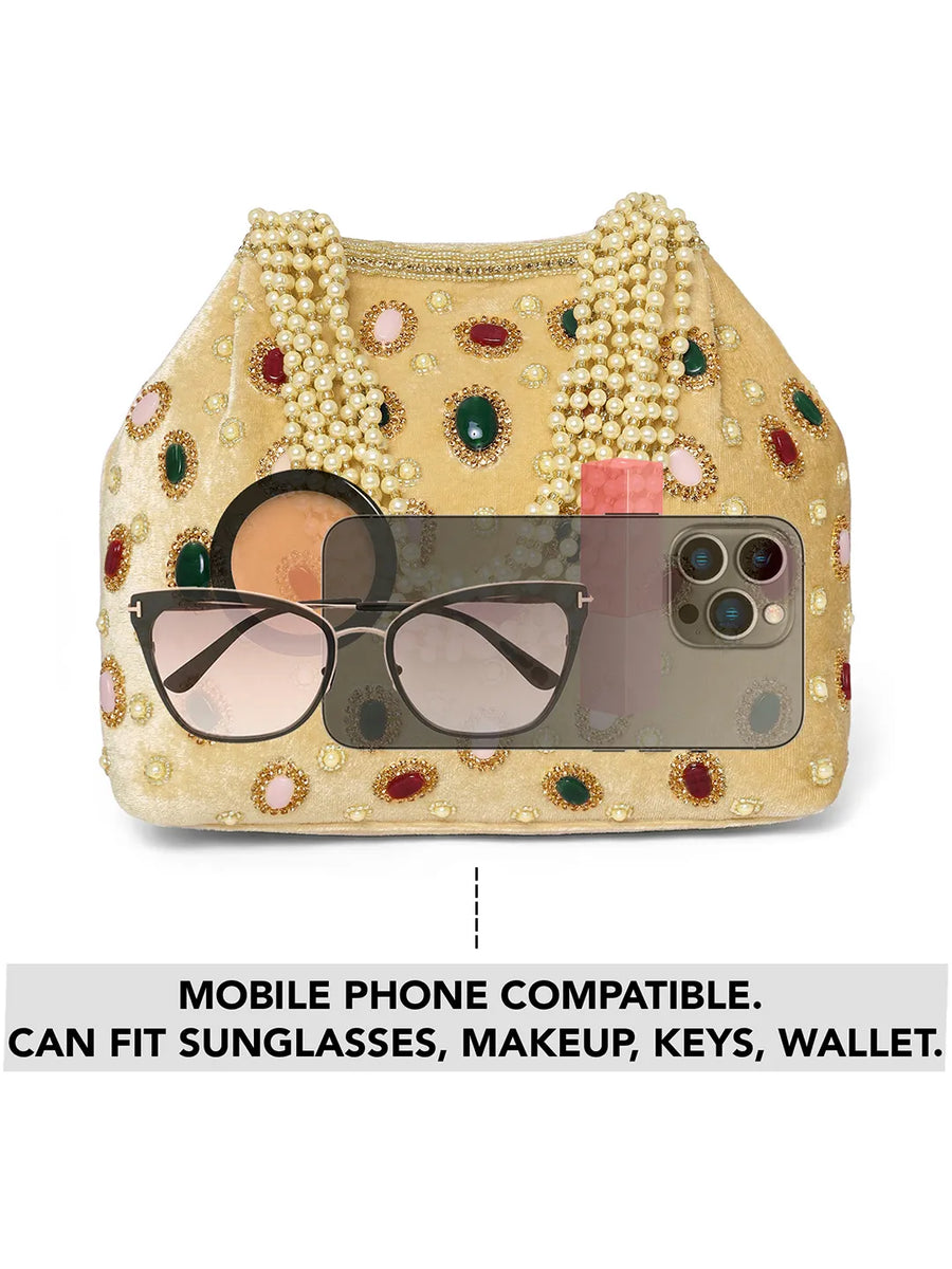 Gold potli bag named Embellished Ethnic Potli with Pearls, featuring faux emerald detailing and soft fabric texture | Peora
