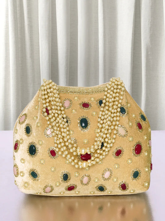 Gold potli bag named Embellished Ethnic Potli with Pearls, featuring faux emerald detailing and soft fabric texture | Peora
