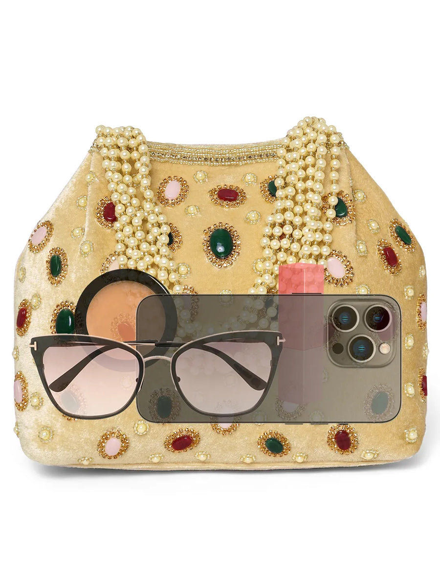 Gold potli bag named Embellished Ethnic Potli with Pearls, featuring faux emerald detailing and soft fabric texture | Peora
