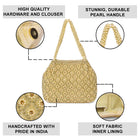 Gold potli bag named Vintage Pearl Embellished Potli, featuring faux pearl detailing and soft fabric texture | Peora

