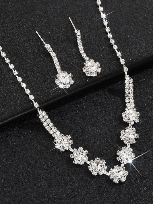 Silver necklace earrings set crafted from alloy, adorned with crystals & cubic zirconia for an elegant, timeless look | Peora
