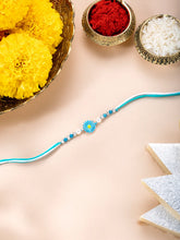 Close-up of Bloom Inspired Sterling Silver Rakhi featuring sky blue & white thread, beads work, and rhodium plating – ideal for Raksha Bandhan | Peora
