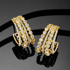 Glamorous Radiant CZ Half Hoop Earrings. A pair of gold-colored half hoop earrings with cubic zirconia embellishments. Ideal for casuals & party looks.